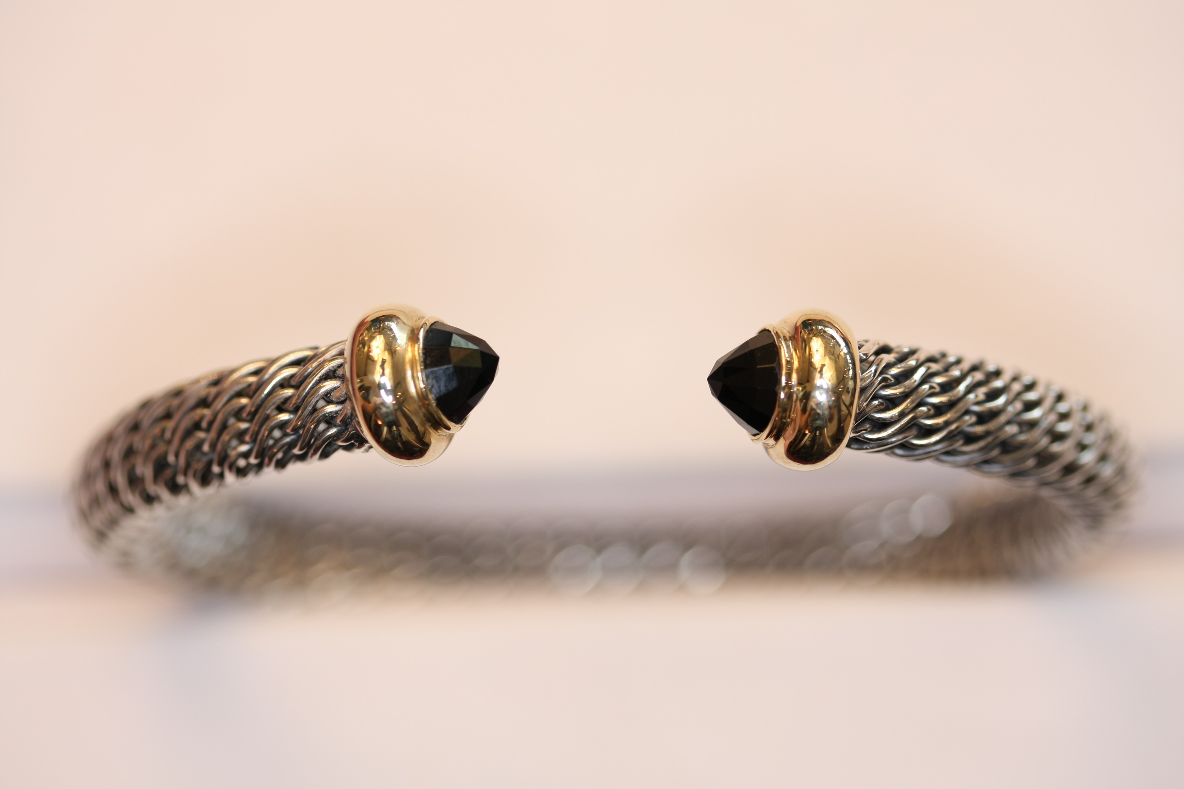 Silver and gold braided bangle with black onyx 